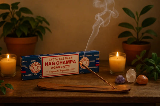 Nag Champa incense sticks burning on wooden meditation altar with candles crystals and plants for relaxation and aromatherapy
